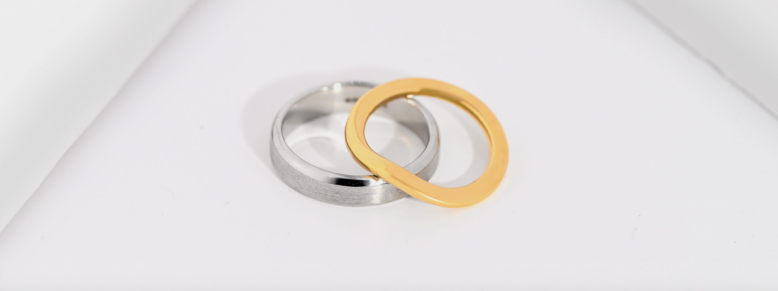 Platinum brushed and polished weeding band with a 18ct gold wishbone band