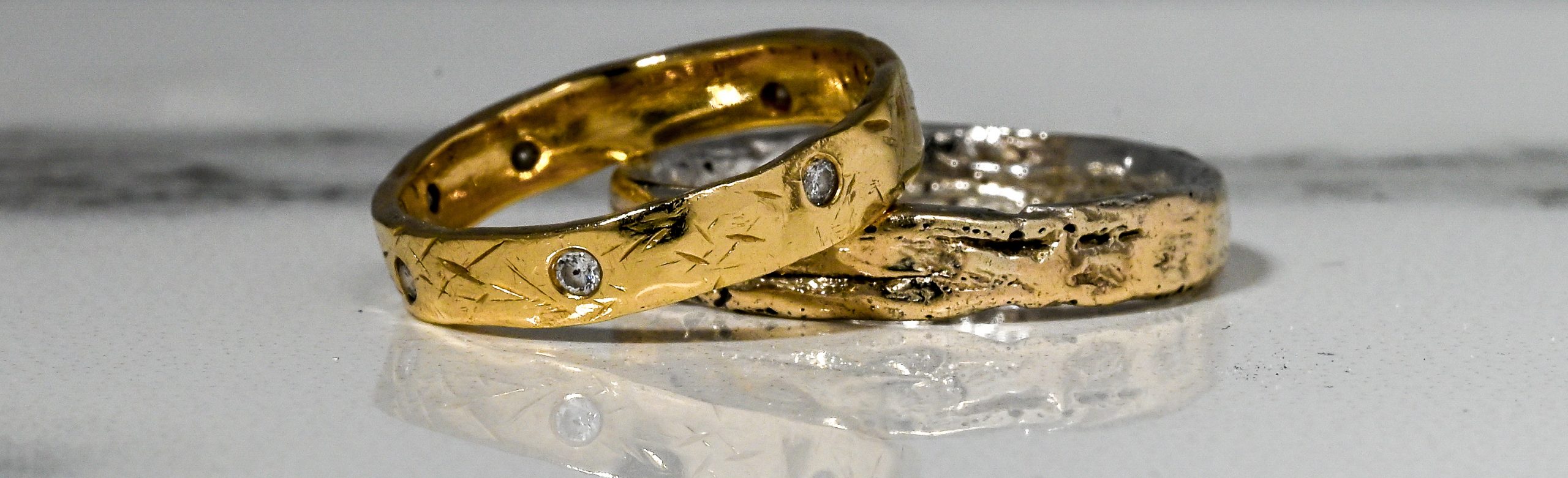 Rustic 9ct wedding bands with flush diamond setting 